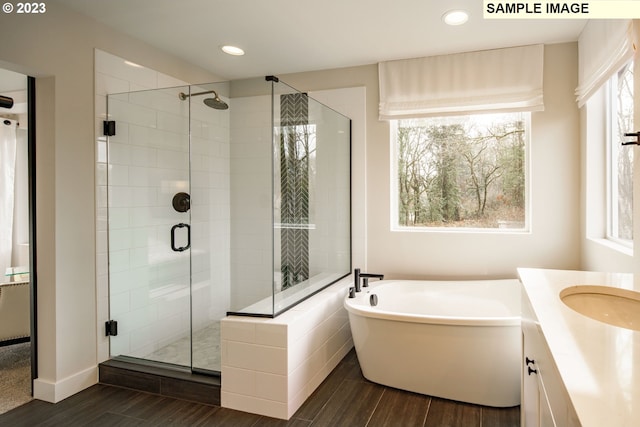 352 S 88th Ave, Ridgefield, WA 98642 - full bath with a freestanding tub, a stall shower, wood finished floors, vanity, and recessed lighting
