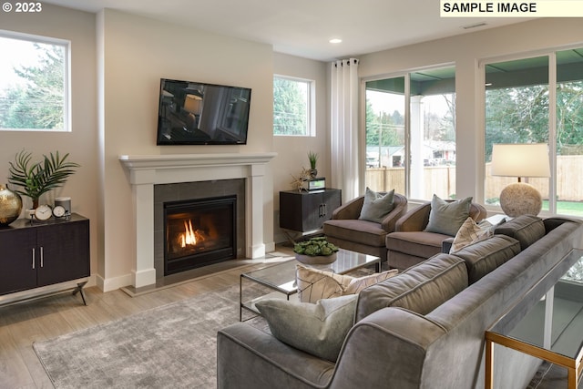 352 S 88th Ave, Ridgefield, WA 98642 - living room with wood finished floors, a fireplace with flush hearth, and recessed lighting
