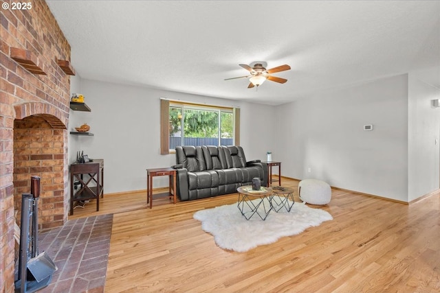 2130 SW 195th Ave, Beaverton, OR 97003 - living area featuring ceiling fan, wood finished floors, and a wood stove