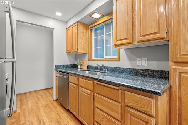 2130 SW 195th Ave, Beaverton, OR 97003 - kitchen featuring stainless steel appliances, light wood-style floors, dark stone counters, and recessed lighting