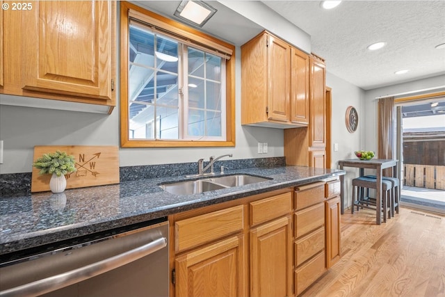2130 SW 195th Ave, Beaverton, OR 97003 - kitchen featuring dishwasher, light wood-style floors, a textured ceiling, recessed lighting, and dark stone countertops