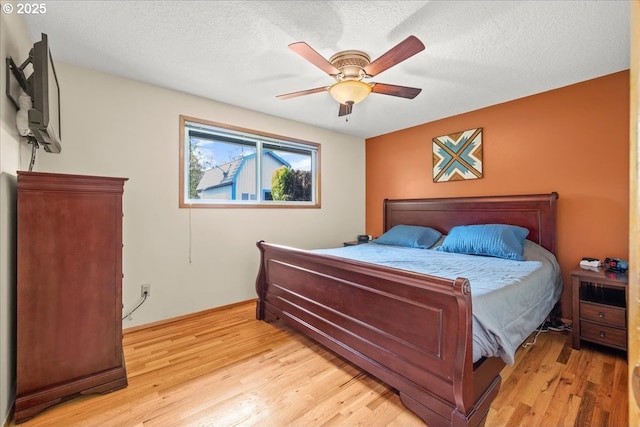 2130 SW 195th Ave, Beaverton, OR 97003 - bedroom featuring light wood-style flooring, a ceiling fan, and a textured ceiling