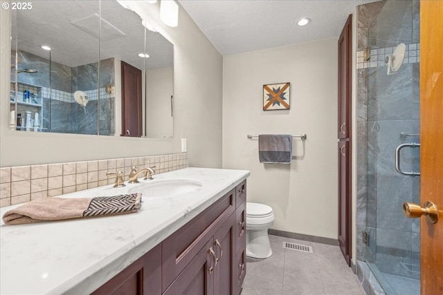 2130 SW 195th Ave, Beaverton, OR 97003 - bathroom with vanity, tile patterned floors, a shower stall, and decorative backsplash