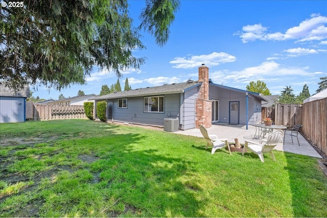 2130 SW 195th Ave, Beaverton, OR 97003 - back of house featuring a patio, a fenced backyard, a chimney, and a storage shed
