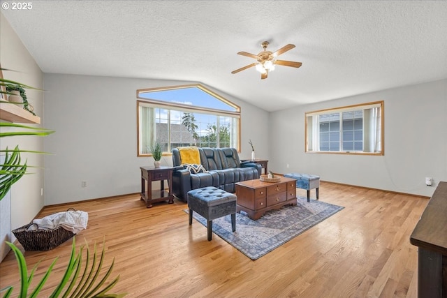 2130 SW 195th Ave, Beaverton, OR 97003 - living room featuring a ceiling fan, light wood-style flooring, lofted ceiling, and a textured ceiling