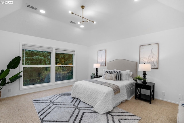 bedroom featuring light carpet, a notable chandelier, and vaulted ceiling