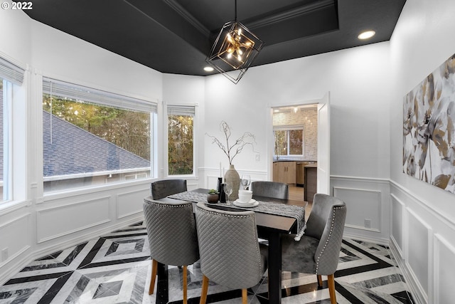 dining room featuring a notable chandelier and plenty of natural light