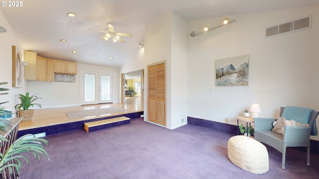 living area featuring visible vents, carpet flooring, recessed lighting, french doors, and high vaulted ceiling