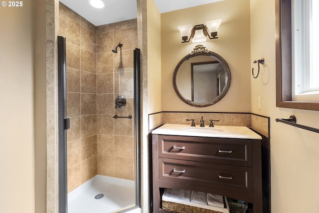 full bathroom featuring a shower stall and vanity