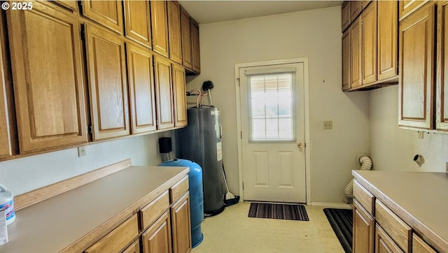 36582 Valley View Ln, Halfway, OR 97834 - clothes washing area featuring water heater and carpet floors