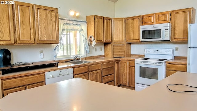 36582 Valley View Ln, Halfway, OR 97834 - kitchen featuring a sink, brown cabinets, white appliances, and light countertops