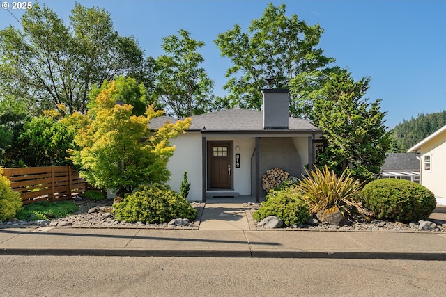 512 NE Division St, Myrtle Creek, OR 97457 - mid-century inspired home with a chimney and stucco siding