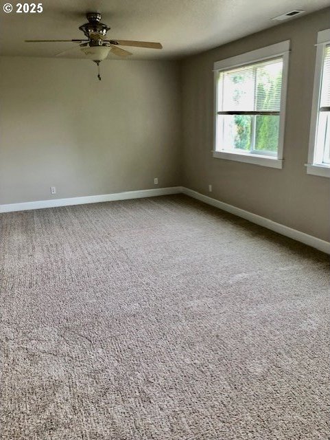 3843 Shannon St, Eugene, OR 97404 - carpeted empty room featuring a ceiling fan and baseboards