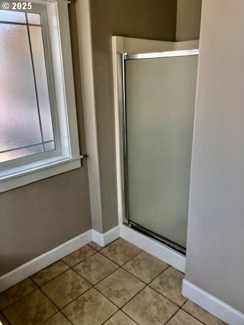 3843 Shannon St, Eugene, OR 97404 - full bath featuring a stall shower, tile patterned floors, and healthy amount of natural light