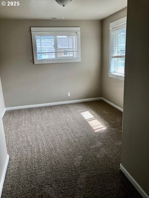 3843 Shannon St, Eugene, OR 97404 - empty room featuring carpet and plenty of natural light
