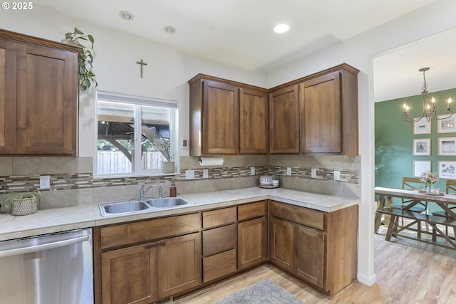 52193 SE Tussing Way, Scappoose, OR 97056 - kitchen featuring dishwasher, a sink, a chandelier, light countertops, and recessed lighting