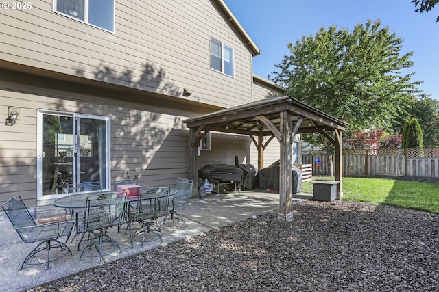 52193 SE Tussing Way, Scappoose, OR 97056 - view of patio / terrace featuring a gazebo, fence, and a grill