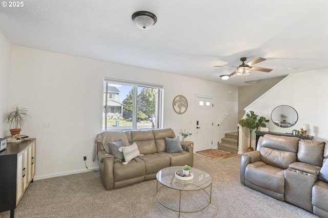 52193 SE Tussing Way, Scappoose, OR 97056 - living area featuring stairway, carpet, ceiling fan, and baseboards