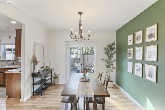 52193 SE Tussing Way, Scappoose, OR 97056 - dining space featuring a chandelier, light wood-style floors, healthy amount of natural light, recessed lighting, and baseboards