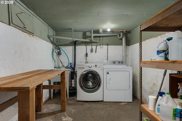 washroom featuring washer and clothes dryer and laundry area