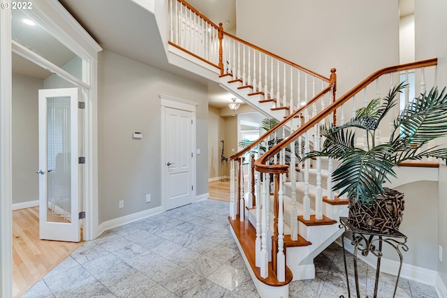 foyer entrance with light tile flooring