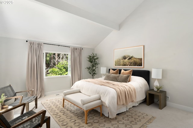 bedroom with light colored carpet and baseboards