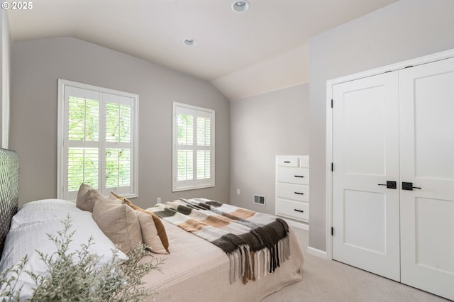 bedroom with lofted ceiling, light carpet, and recessed lighting