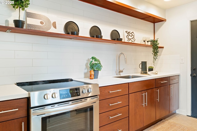 841 NE 77th Ave, Portland, OR 97213 - kitchen with electric range, open shelves, backsplash, and brown cabinetry