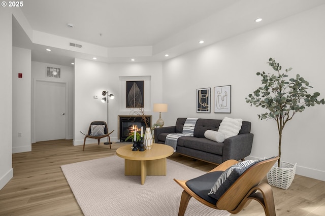 living room with light hardwood / wood-style flooring