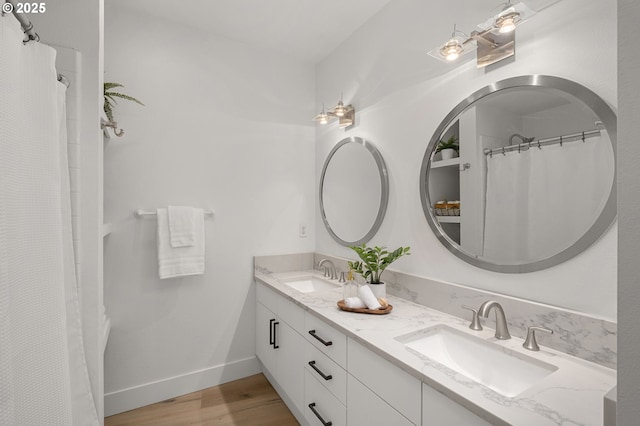 bathroom featuring hardwood / wood-style floors and vanity