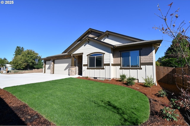 view of front of home with a garage and a front lawn