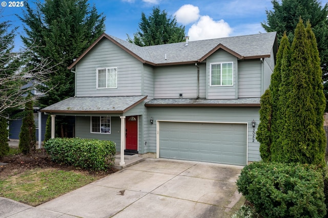 3052 Tierra Dr, Salem, OR 97305 - view of front of house featuring a garage, concrete driveway, and a shingled roof