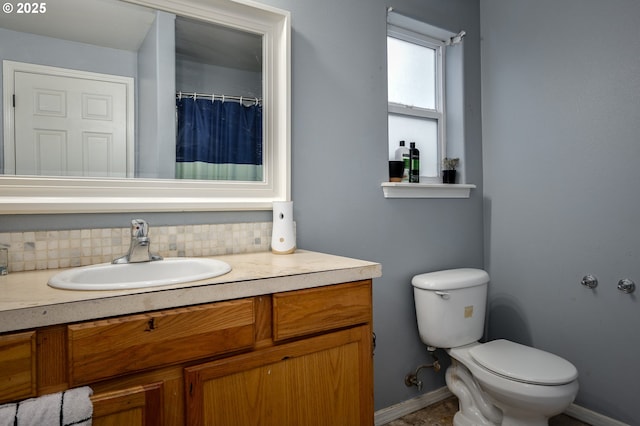3052 Tierra Dr, Salem, OR 97305 - bathroom with vanity, toilet, baseboards, and backsplash