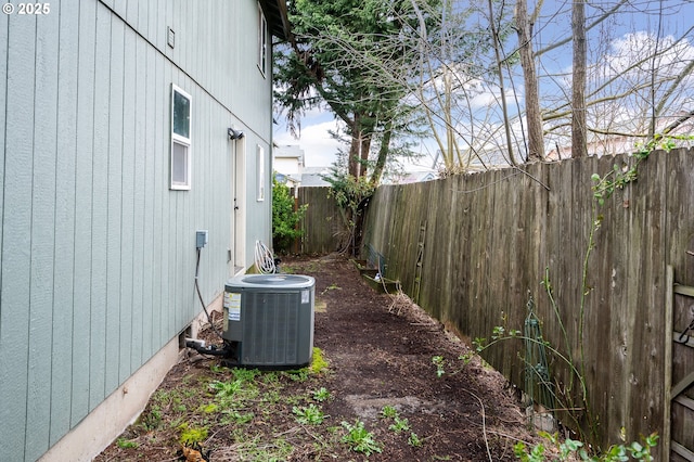 3052 Tierra Dr, Salem, OR 97305 - view of home's exterior with cooling unit and a fenced backyard