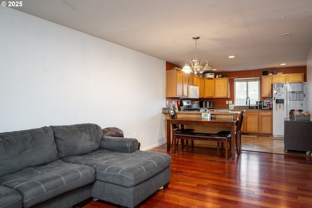 3052 Tierra Dr, Salem, OR 97305 - living area featuring recessed lighting, light wood-style floors, baseboards, and a chandelier