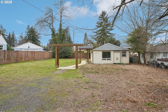 view of yard featuring an outbuilding and a fenced backyard