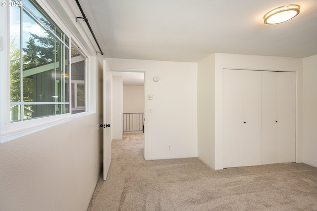 interior space featuring carpet floors and plenty of natural light