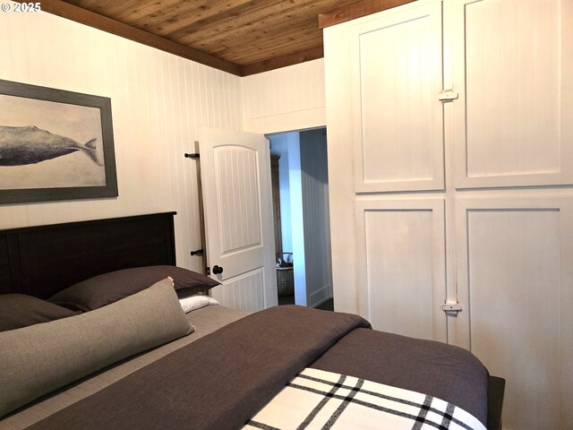 208 Acacia Ave, Garibaldi, OR 97118 - bedroom featuring wooden ceiling, baseboards, and wood finished floors