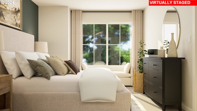 bedroom featuring light carpet