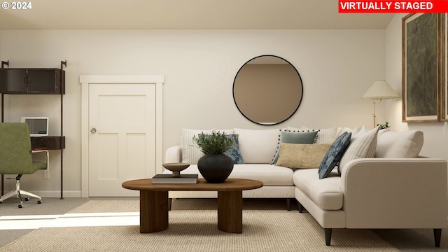carpeted living room with baseboards