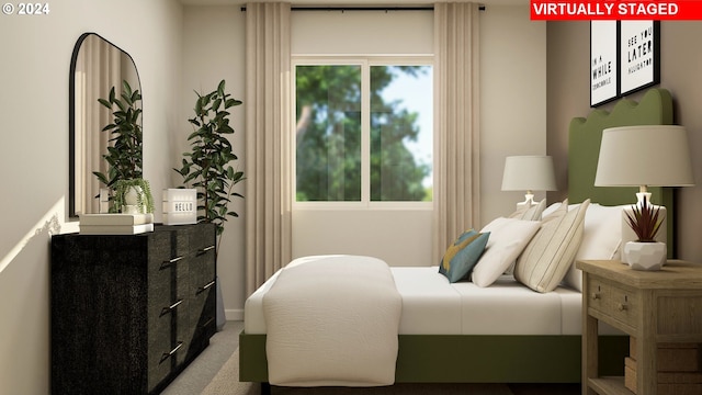 carpeted bedroom with baseboards