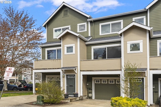 19089 SW Quinn Ct, Beaverton, OR 97003 - view of property featuring an attached garage, driveway, and a shingled roof