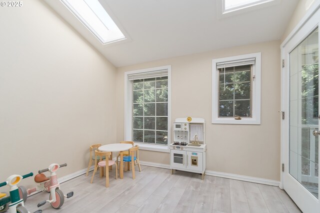 kitchen featuring white cabinetry, sink, light hardwood / wood-style flooring, and appliances with stainless steel finishes