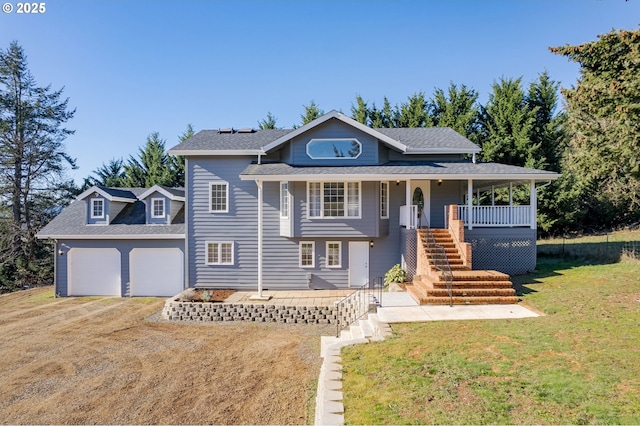 view of front of home featuring a garage, covered porch, and a front yard