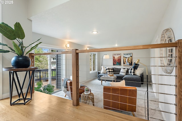 living area featuring recessed lighting, wood finished floors, and baseboards