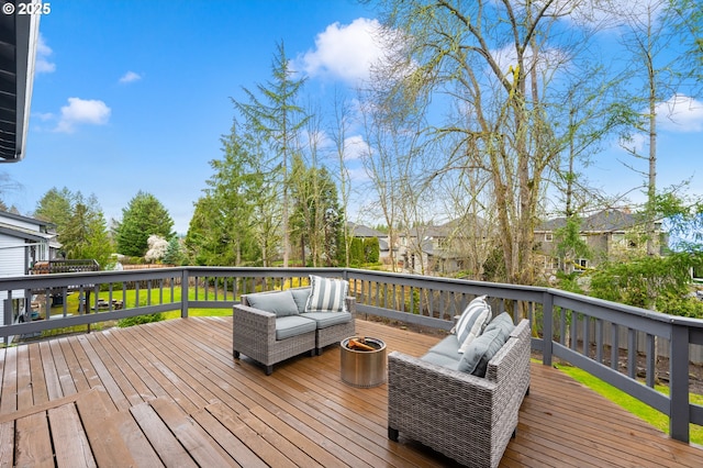 wooden deck with an outdoor living space and a residential view