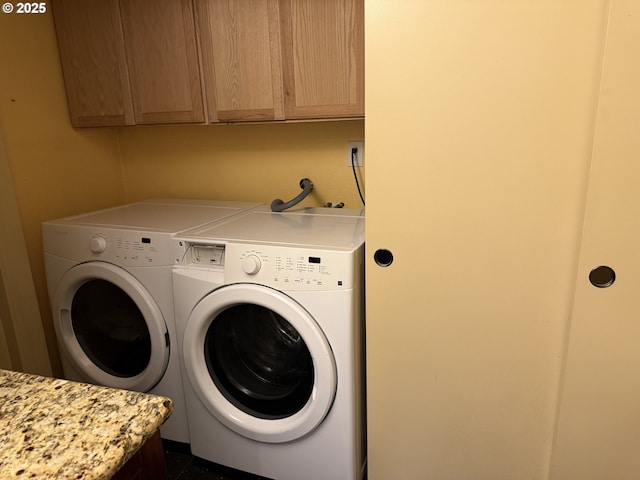 31431 Fairview Rd, Rainier, OR 97048 - washroom featuring cabinet space and separate washer and dryer