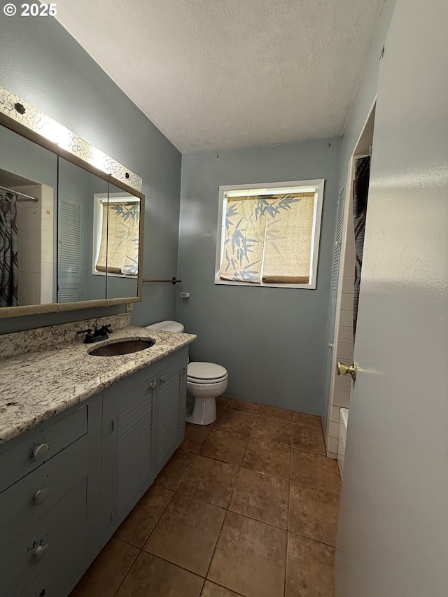 31431 Fairview Rd, Rainier, OR 97048 - full bath featuring vanity, toilet, curtained shower, a textured ceiling, and tile patterned floors