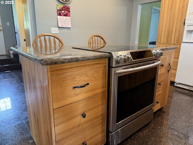 31431 Fairview Rd, Rainier, OR 97048 - kitchen with electric range, white refrigerator with ice dispenser, and granite tiled floors