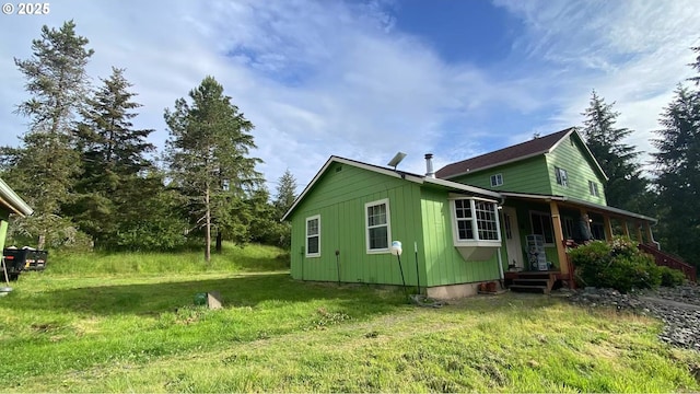 31431 Fairview Rd, Rainier, OR 97048 - view of property exterior with a yard and a porch